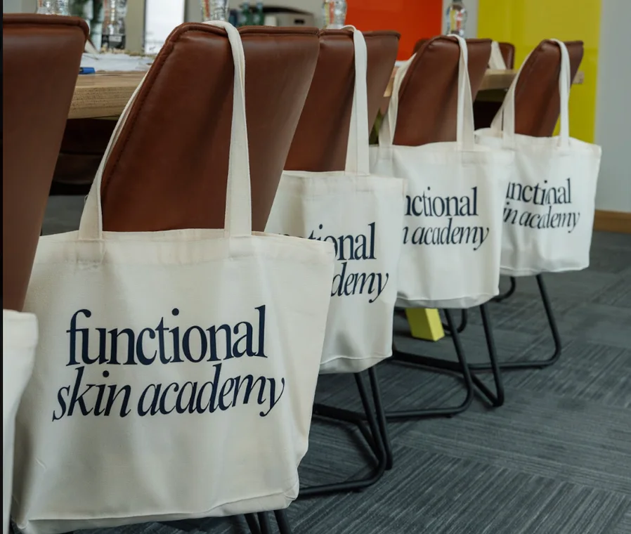 Functional Skin Academy tote bags on the chairs, ready for the day